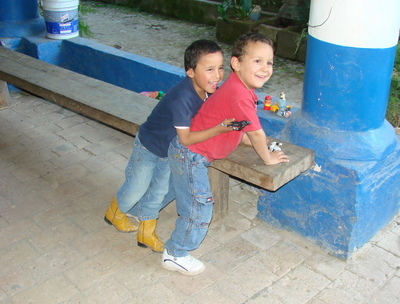 Two boys, laughing and giggling.